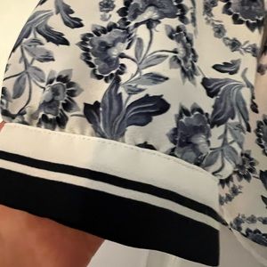 Gorgeous, new paisley marked blouse with blue trim sleeves. Never worn. NWOT.